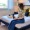 a woman sitting on a bed