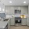 a kitchen with white cabinets