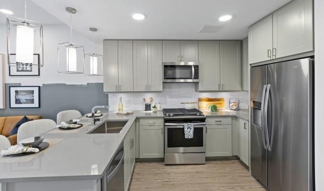 a kitchen with white cabinets