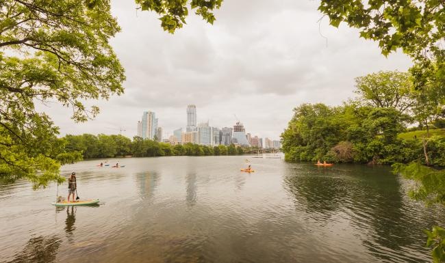 a body of water with boats and trees around it