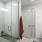 a bathroom with a shower unit and a sink