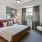 a bedroom with a large window
