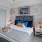 a bedroom with a bed and a fan