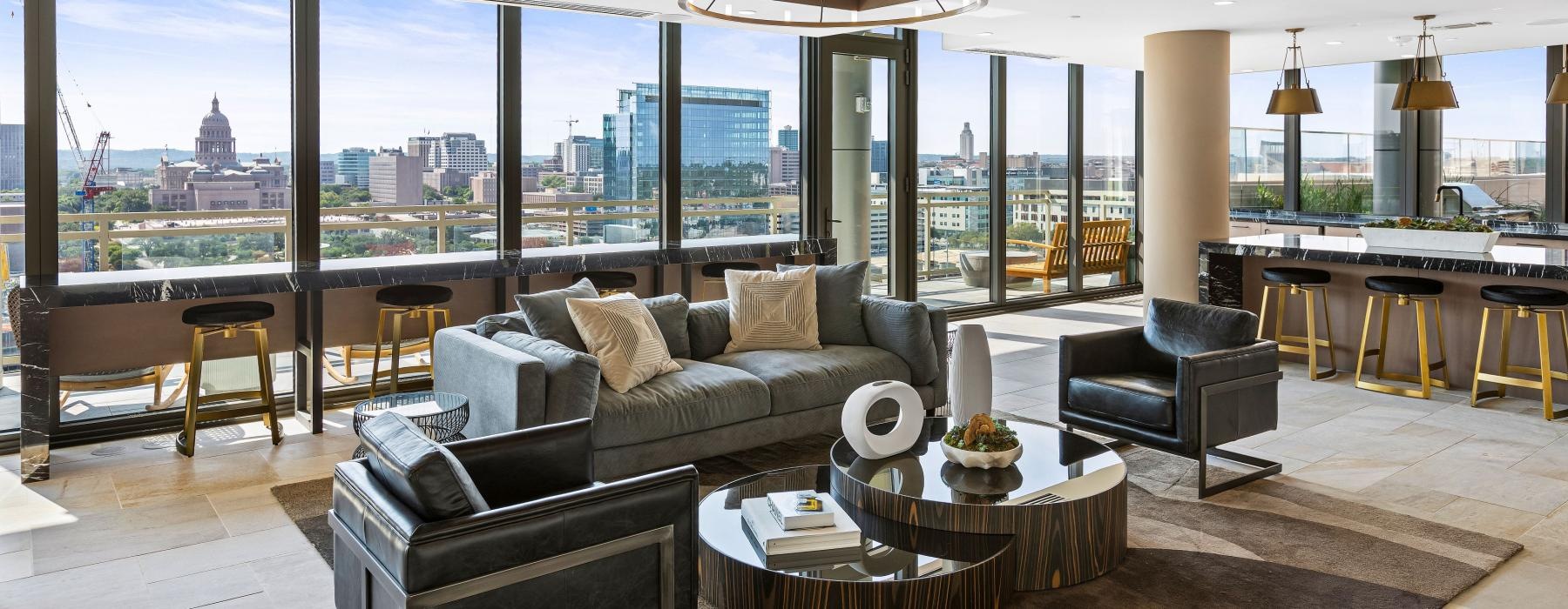 a living room with a view of the city