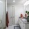 a bathroom with a shower unit and a sink