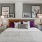 a bedroom with a bed and lamps