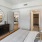 a bedroom with a large mirror