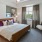 a bedroom with a large window